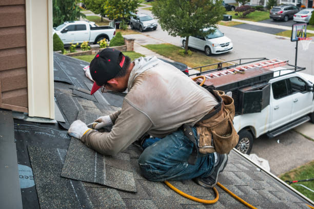 Professional Roofing technician working in Jamaica, IA